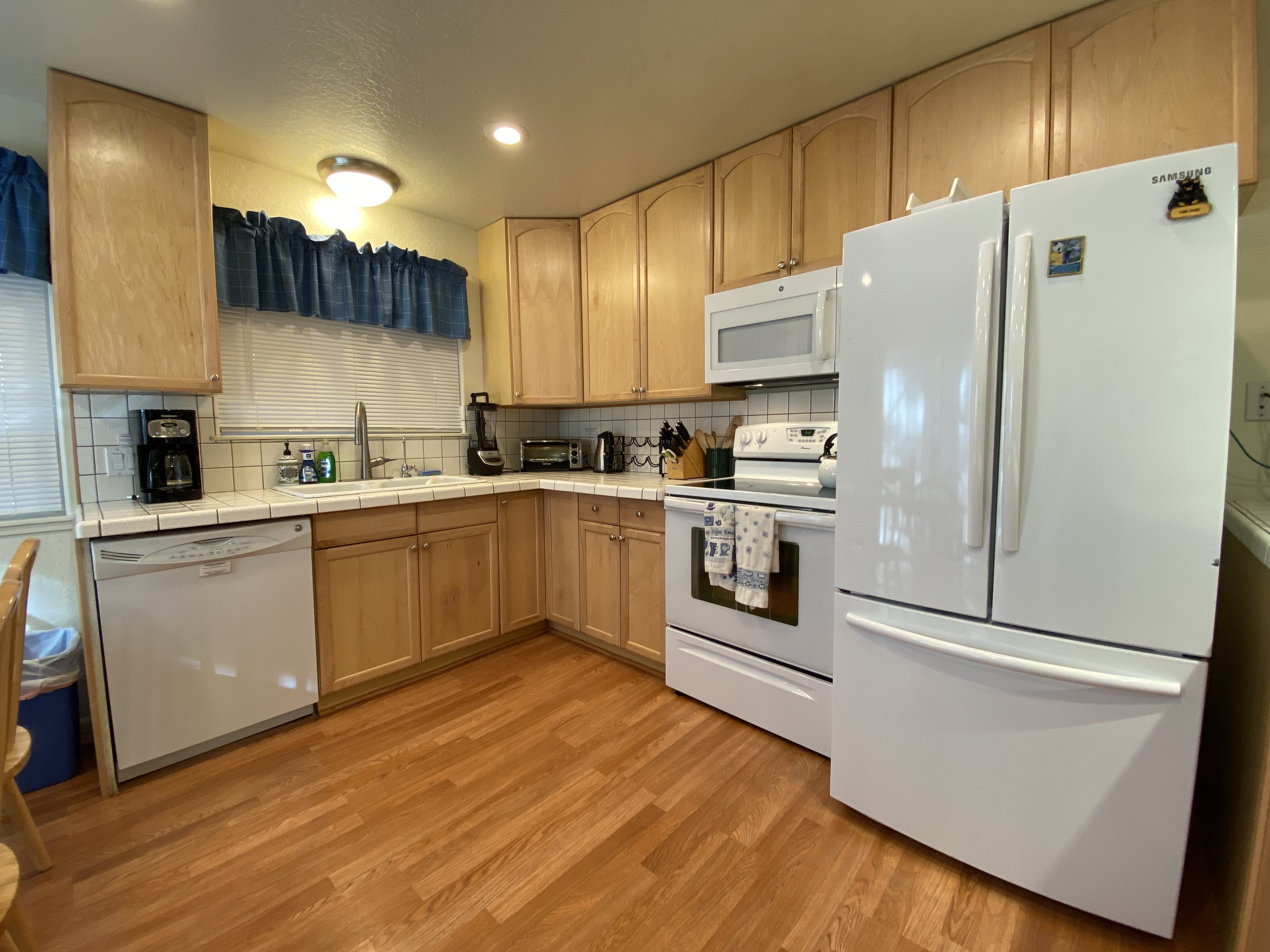 Kitchen range, microwave, and refrigerator